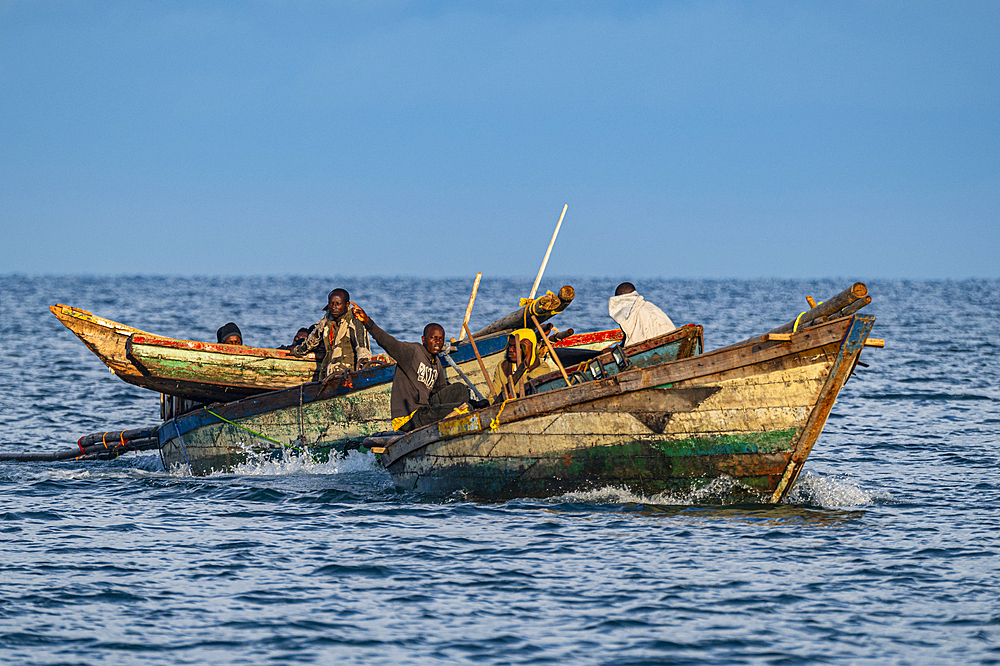 Wooden fishing boats and fishermen, Kigoma, Lake Tanganyika, Tanzania, East Africa, Africa