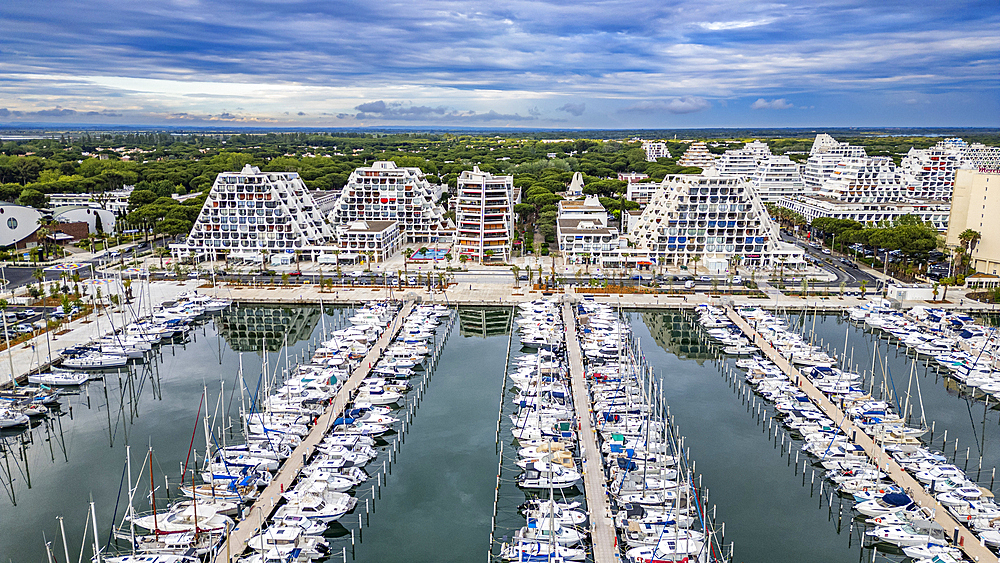 Aerial of the sport harbour, futuristic seaside town of La Grande Motte, Herault, Occitania, France, Europe