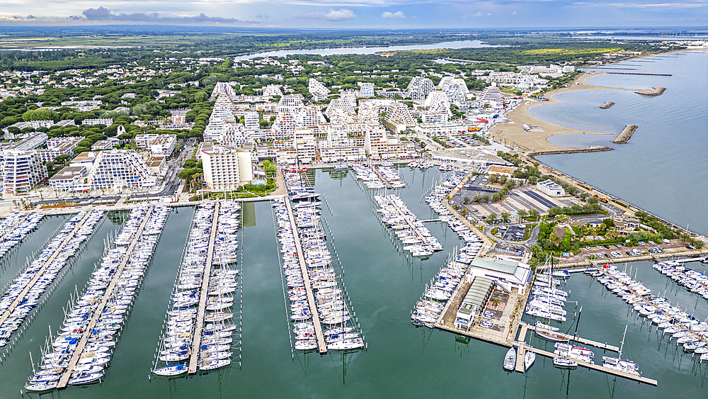 Aerial of the sport harbour, futuristic seaside town of La Grande Motte, Herault, Occitania, France, Europe