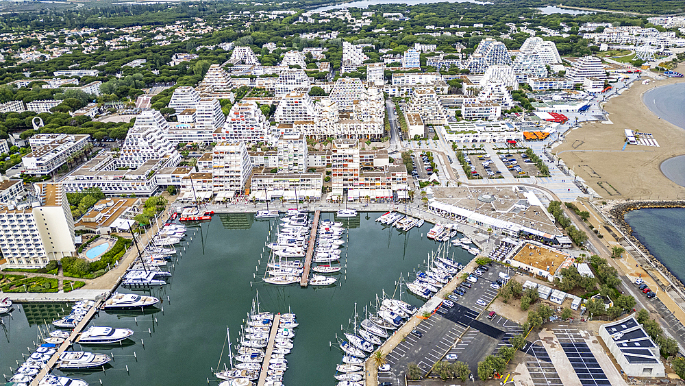 Aerial of the sport harbour, futuristic seaside town of La Grande Motte, Herault, Occitania, France, Europe