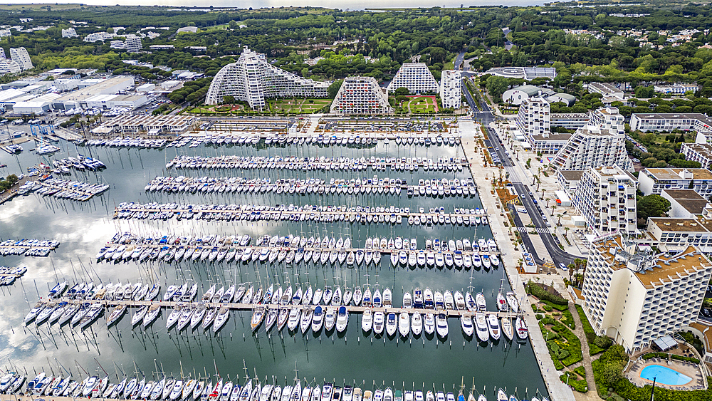 Aerial of the sport harbour, futuristic seaside town of La Grande Motte, Herault, Occitania, France, Europe