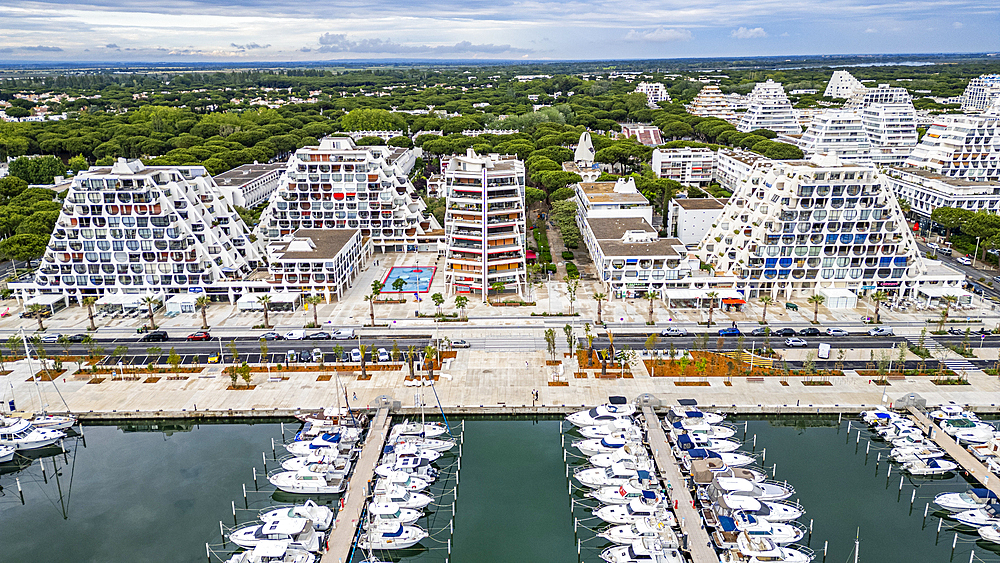 Aerial of the sport harbour, futuristic seaside town of La Grande Motte, Herault, Occitania, France, Europe