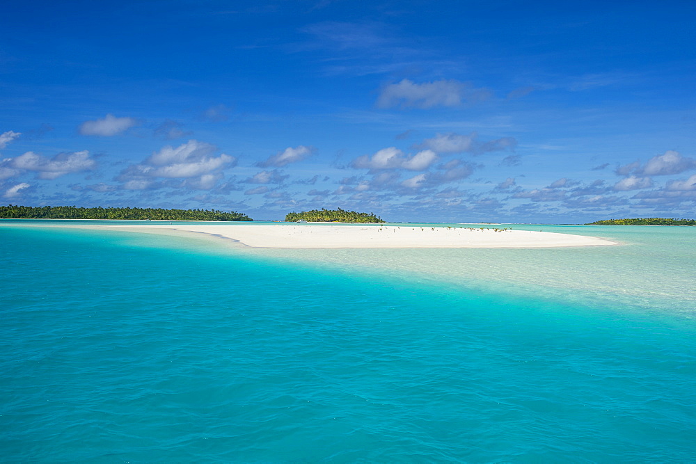 White sand beach and palm fringed beach in Aitutaki lagoon, Rarotonga and the Cook Islands, South Pacific, Pacific