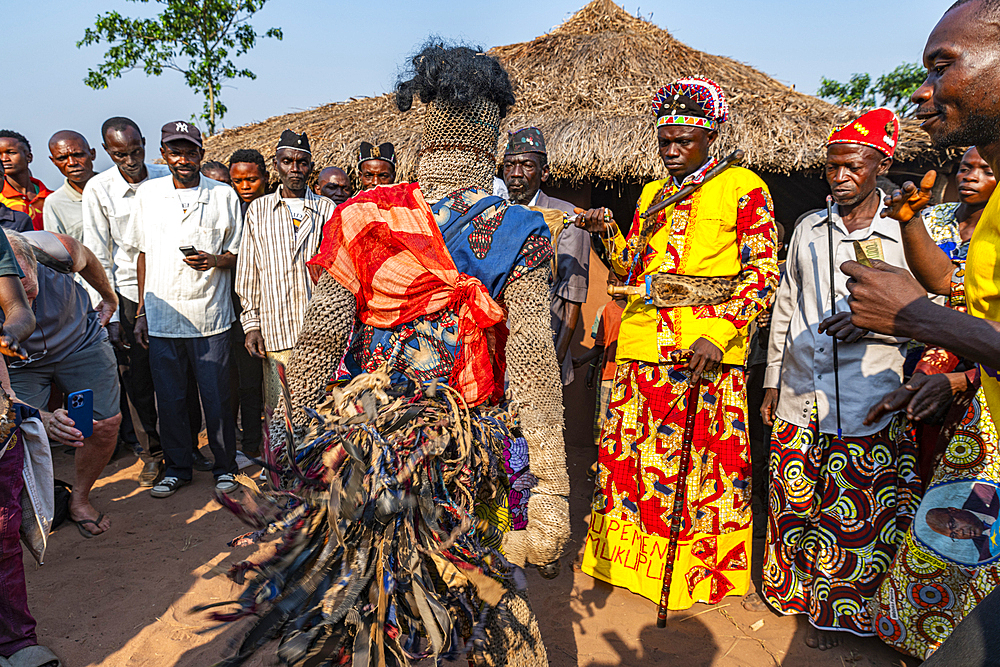 Traditional masked man dancing, Tshikapa, Kasai, Democratic Republic of Congo, Africa