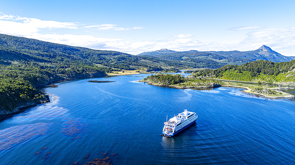 Aerial of a cruise ship anchoring in Wulaia Bay, Tierra del Fuego, Chile, South America