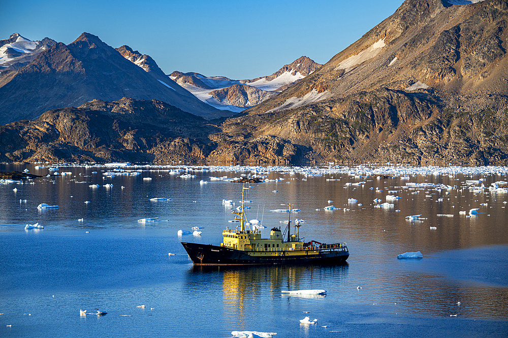 Fishing trawler in the mountainous fjord, Kulusuk, Greenland, Denmark, Polar Regions