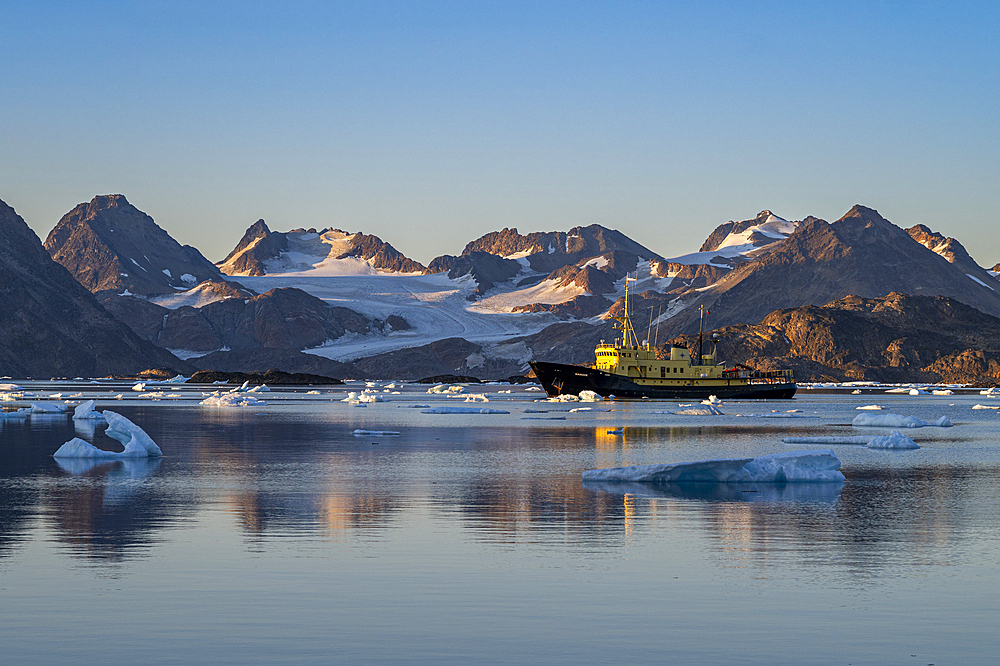 Fishing trawler in the mountainous fjord, Kulusuk, Greenland, Denmark, Polar Regions