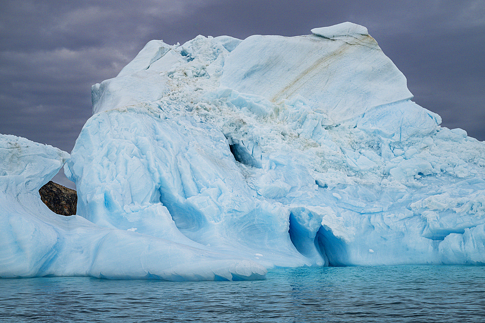 Hole in an iceberg, Belcher island, Devon island, Nunavut, Canadian Arctic, Canada, North America