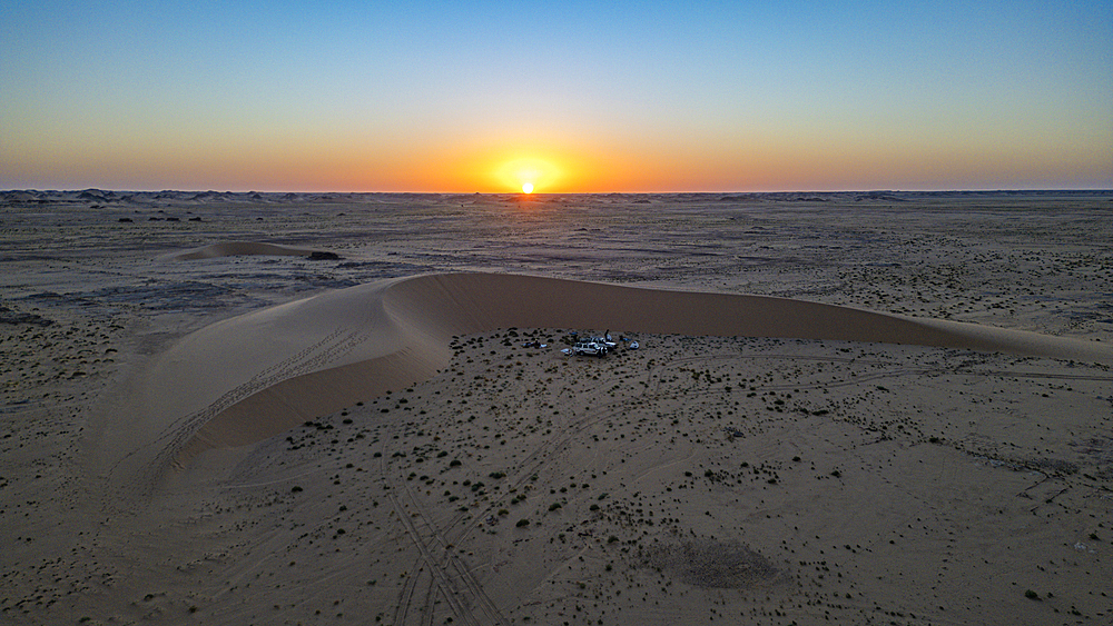 Aerial of sunset over a beautiful sand dune in the Tibesti Mountains, Chad, Africa