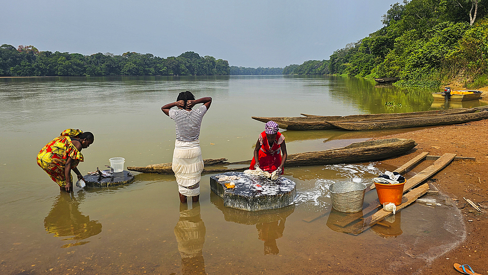 Woman handcleaning in the Sangha River, Unesco site Dzanga Sangha National Park, Central African Republic