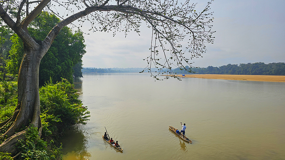 Locals in a canoe on the Sangha river, Unesco site Dzanga Sangha National Park, Central African Republic