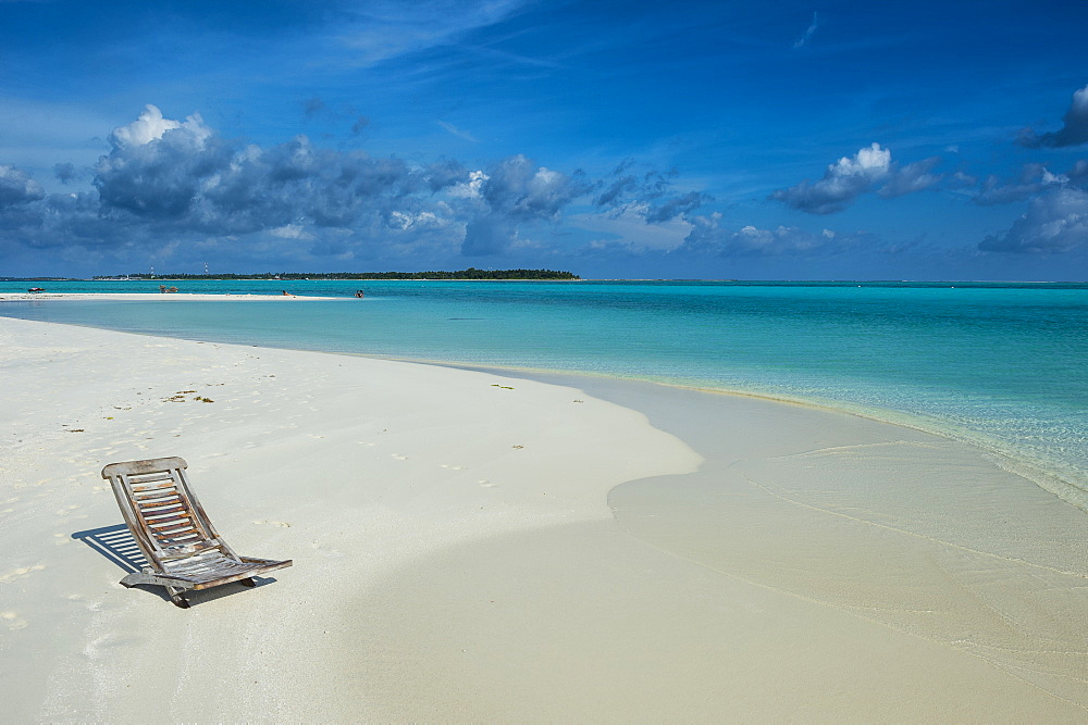 Sun chair on a white sand beach and turquoise water, Sun Island Resort, Nalaguraidhoo island, Ari atoll, Maldives, Indian Ocean, Asia