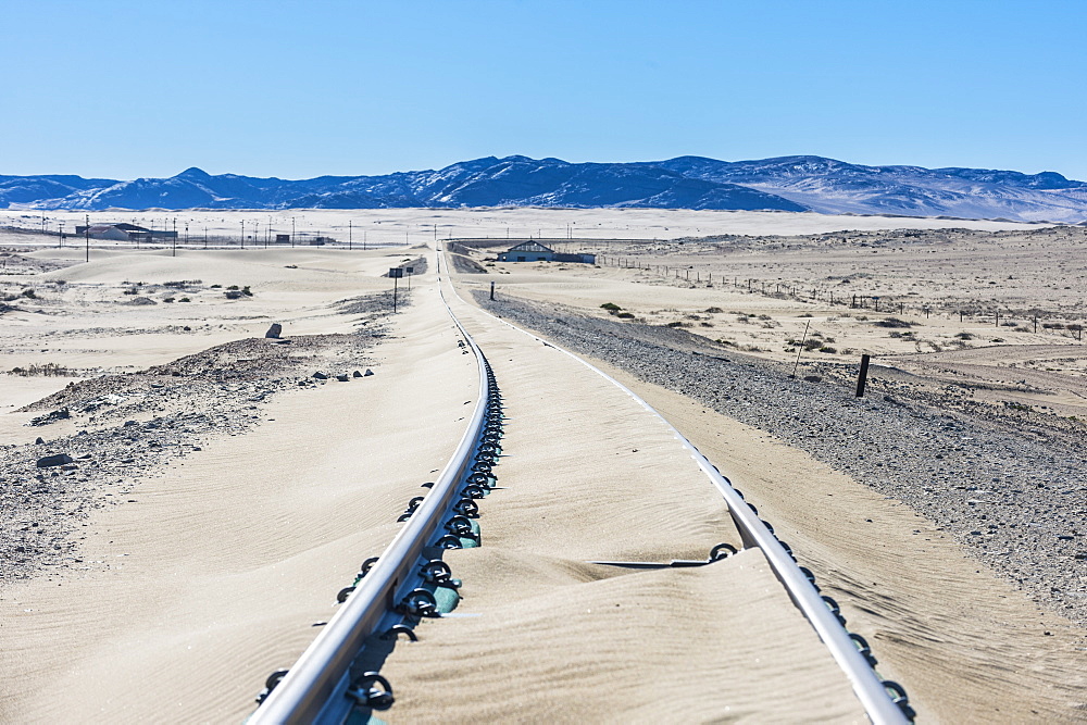 Railway tracks overflown by sand, old diamond ghost town, Kolmanskop, near Luderitz, Namibia, Africa