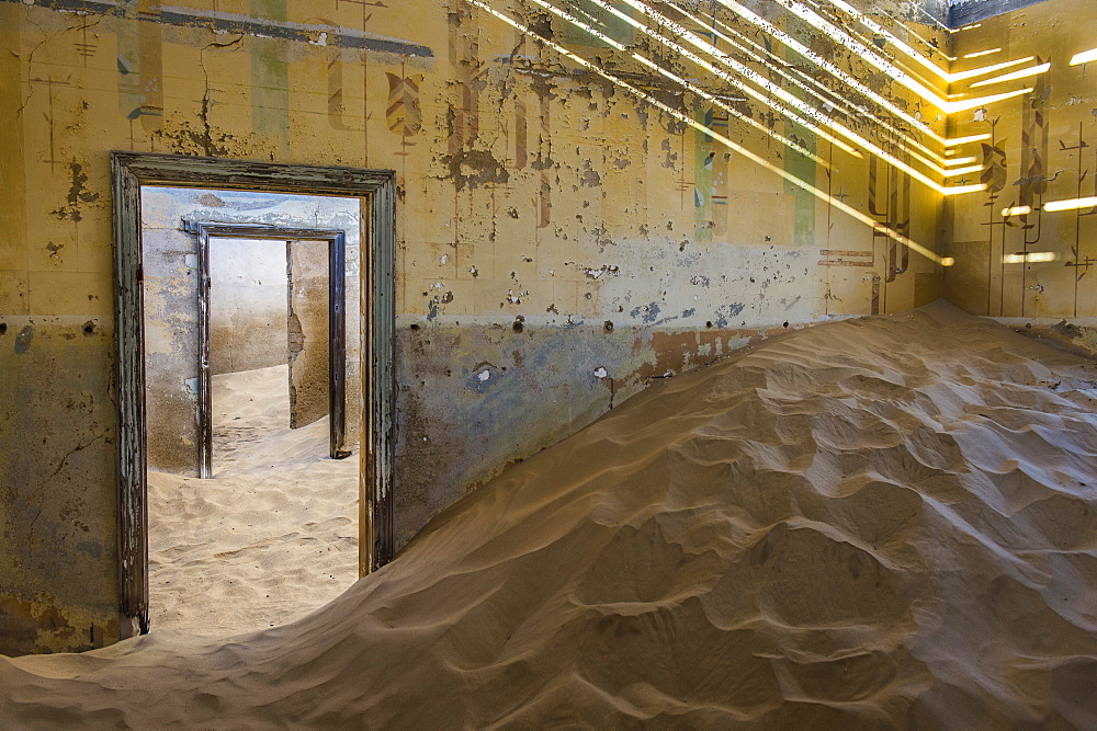 Sand in an old colonial house, old diamond ghost town,  Kolmanskop (Coleman's Hill), near Luderitz, Namibia, Africa