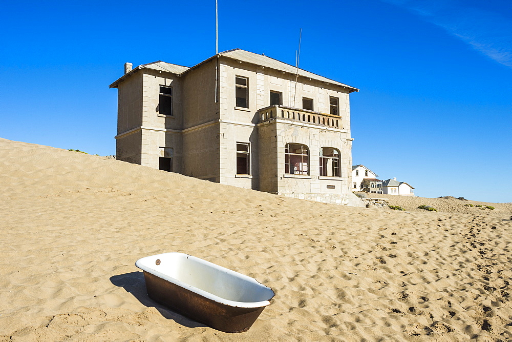 Bathtub standing in the desert, old diamond ghost town, Kolmanskop (Coleman's Hill), near Luderitz, Namibia, Africa