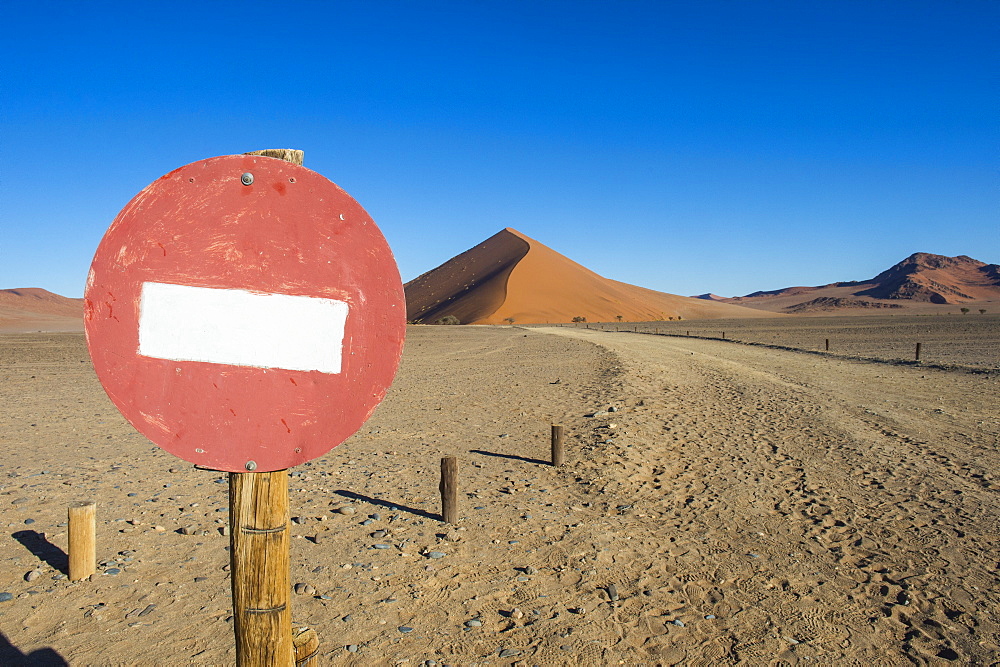 No passing sign in front of the giant sand Dune 45, Sossusvlei, Namib-Naukluft National Park, Namibia, Africa