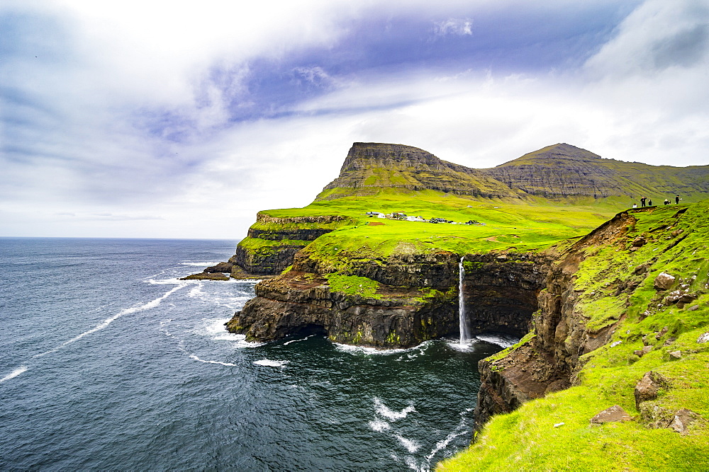 Gasadalur waterfall into the ocean, Vagar, Faroe Islands, Denmark, Europe