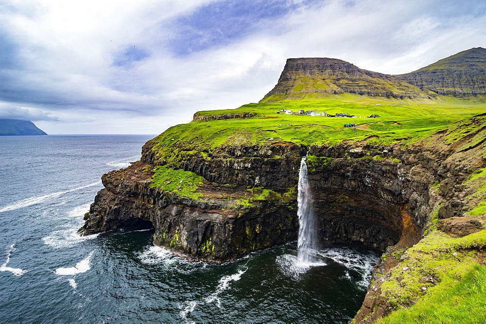 Gasadalur waterfall into the ocean, Vagar, Faroe Islands, Denmark, Europe