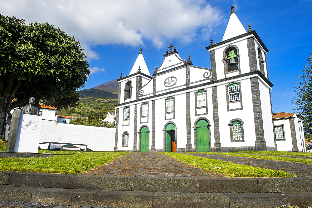 Paroquia de Sao Mateus church below Ponta do Pico, highest mountain of Portugal, Island of Pico, Azores, Portugal, Atlantic, Europe