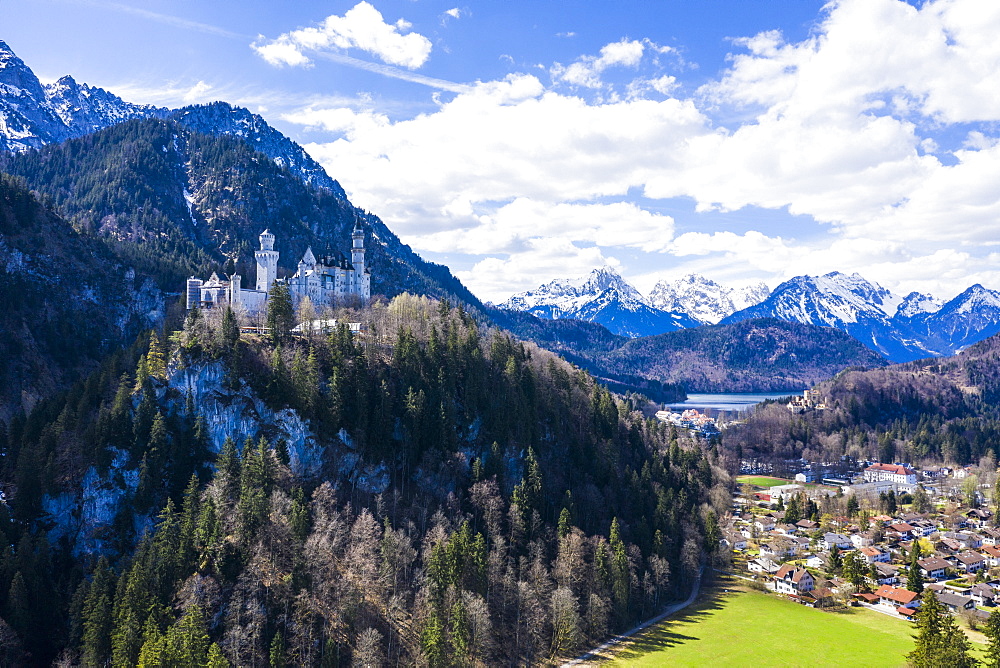 Aerial of Castle Neuschwanstein, with the Alps behind, Schwangau, Bavaria, Germany, Europe