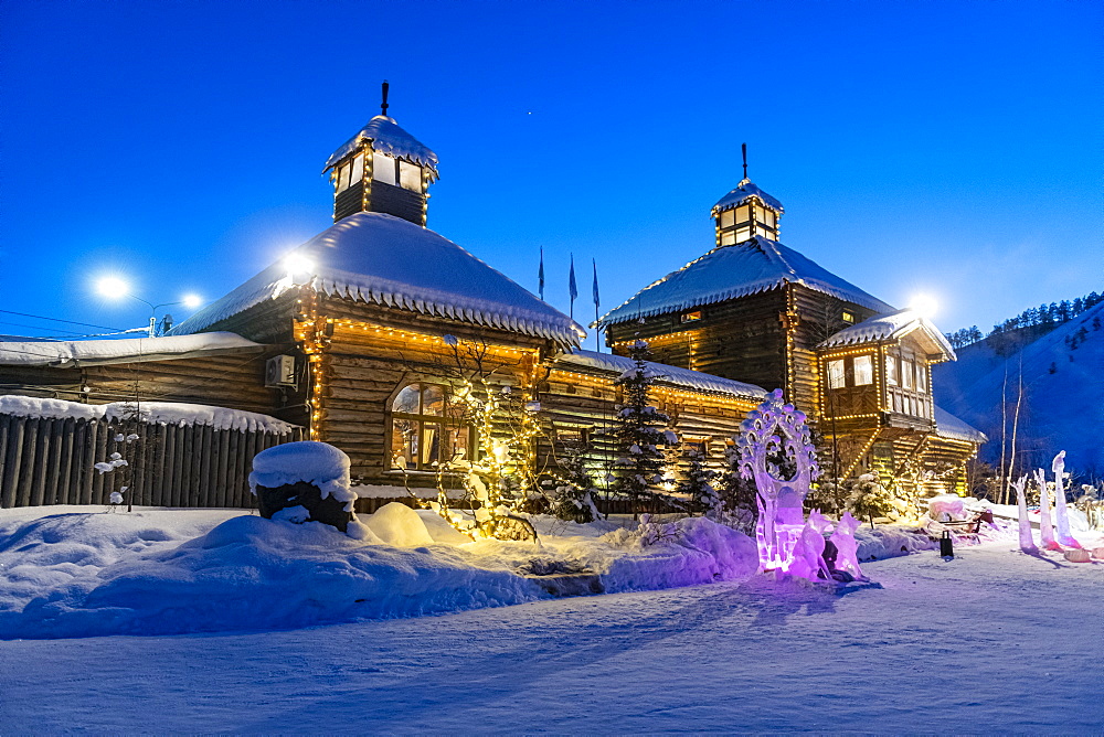 Beautiful traditional wooden house after sunset, Yakutsk, Sakha Republic (Yakutia), Russia, Eurasia