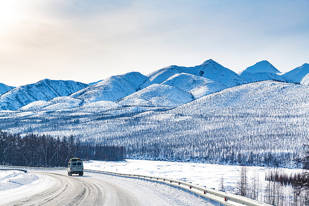 Minivan driving on the Road of Bones, Suntar-Khayata Range, Sakha Republic (Yakutia), Russia, Eurasia