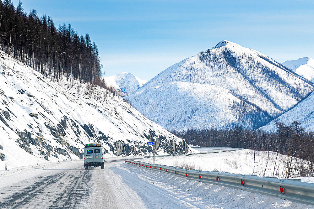 Minivan driving on the Road of Bones, Suntar-Khayata Range, Sakha Republic (Yakutia), Russia, Eurasia