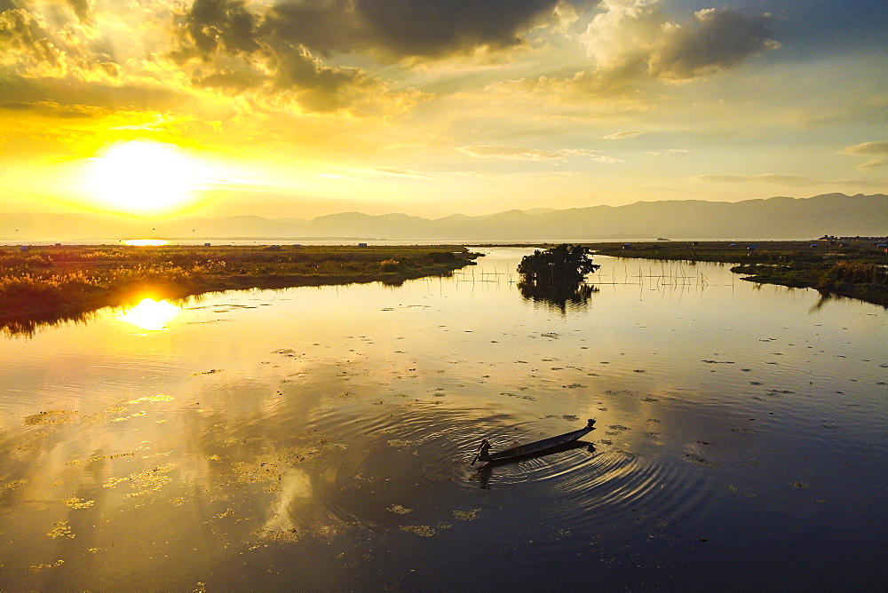 View by drone of rowing boat at sunset, Inle Lake, Shan state, Myanmar (Burma), Asia