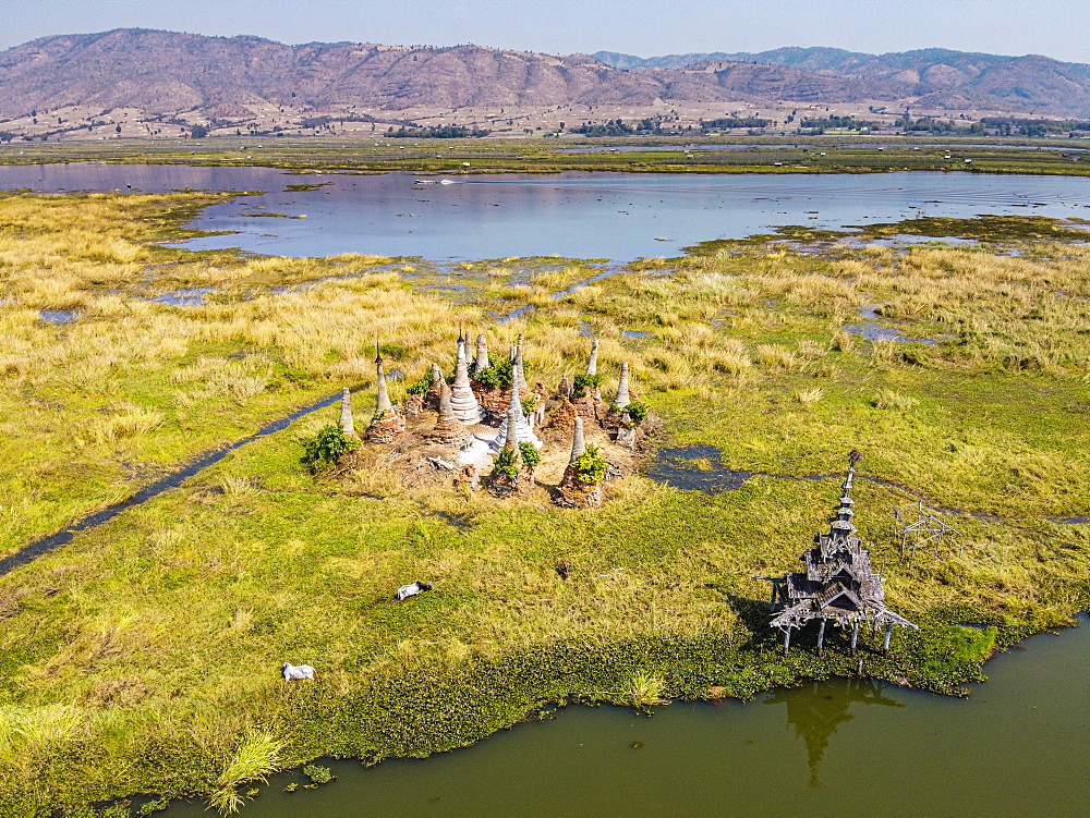 Aerial by drone of little pagodas sitting in the waters of the southern Inle Lake, Nyaungshwe, Shan state, Myanmar (Burma), Asia