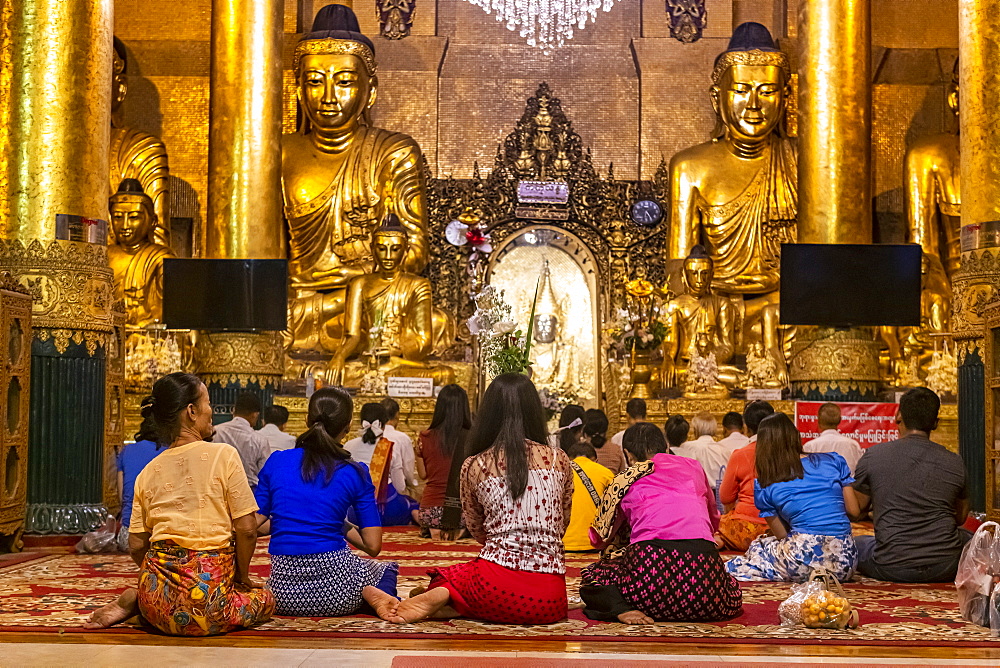 Pilgrims in the Shwedagon pagoda, Yangon (Rangoon), Myanmar (Burma), Asia