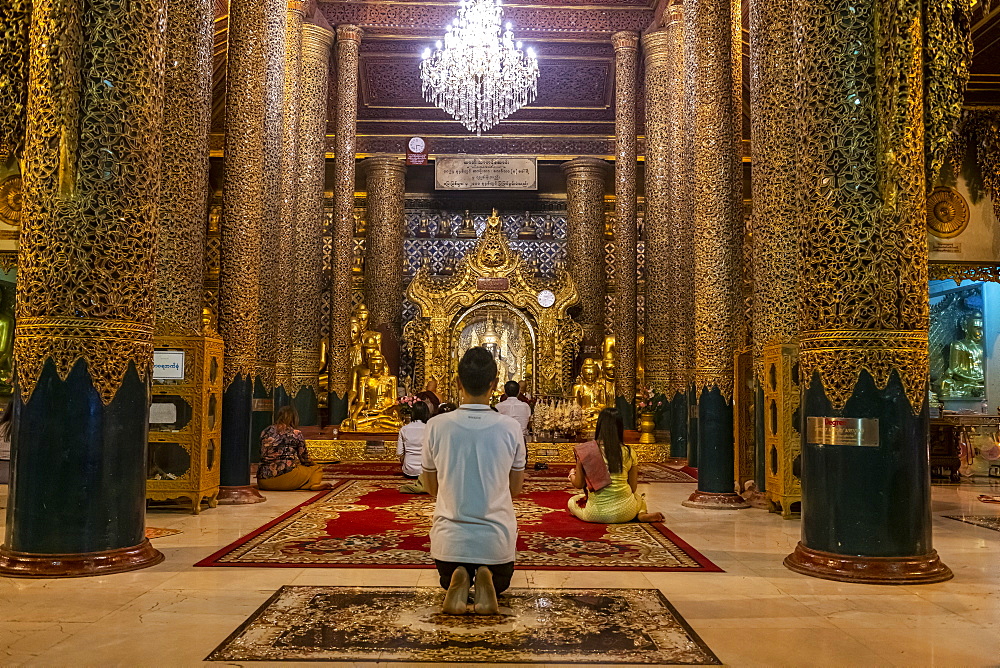 Pilgrims in the Shwedagon pagoda, Yangon (Rangoon), Myanmar (Burma), Asia