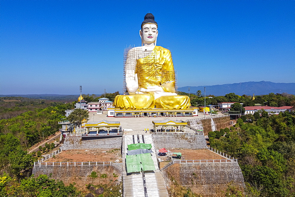 Aerial of a giant sitting Buddha below the Kyaiktiyo Pagoda (Golden Rock), Mon state, Myanmar (Burma), Asia