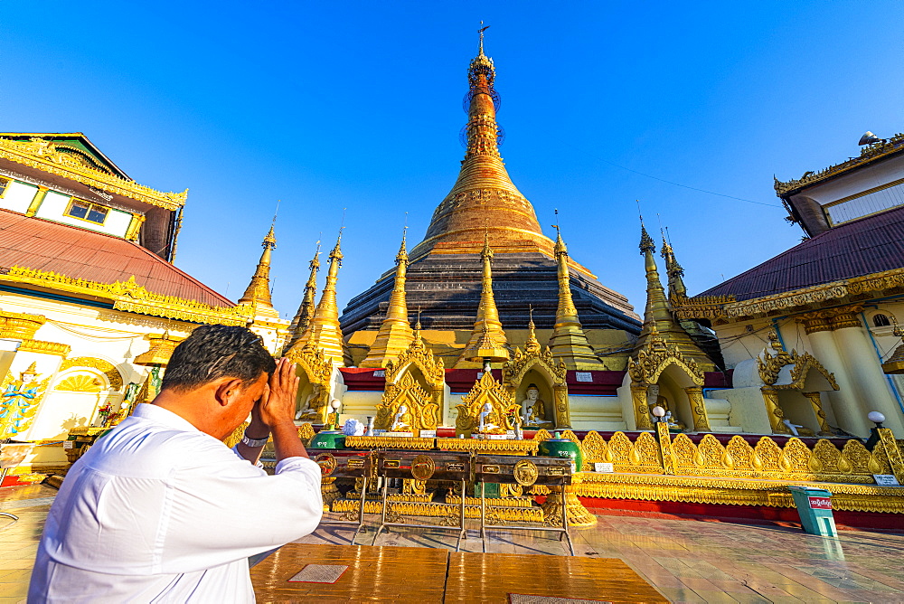 Man praying in the Kyaikthanian paya, Mawlamyine, Mon state, Myanmar (Burma), Asia