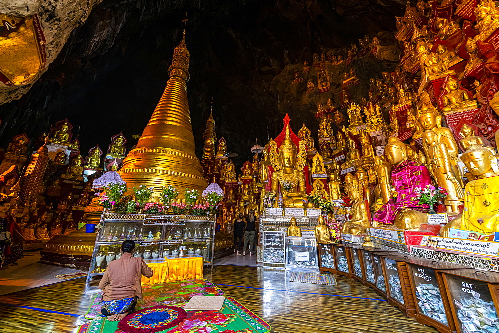 Pilgrims at the gilded Buddha images in the caves at Pindaya, Shan state, Myanmar (Burma), Asia