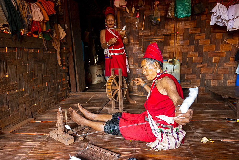 Old Kayan women weaving the traditional way, Kayah village, Loikaw area, Kayah state, Myanmar (Burma), Asia