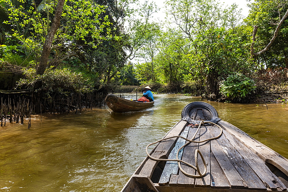 Rowing through a small water channel, Cai Be, Mekong Delta, Vietnam, Indochina, Southeast Asia, Asia