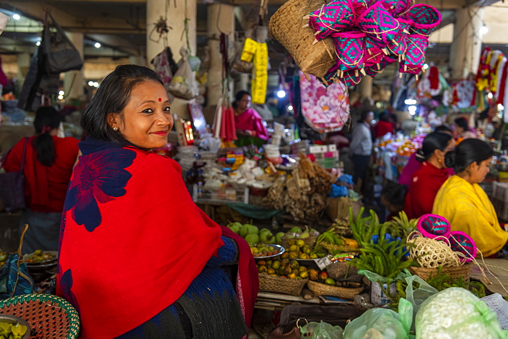 Woman vendor selling colourful dolls, Ima Keithel women's market, Imphal, Manipur, India, Asia