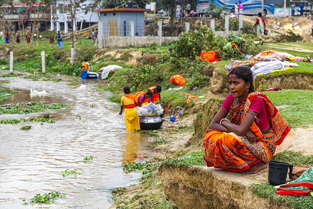 Pretty girl sitting above a creek, Sreemagal, Bangladesh, Asia