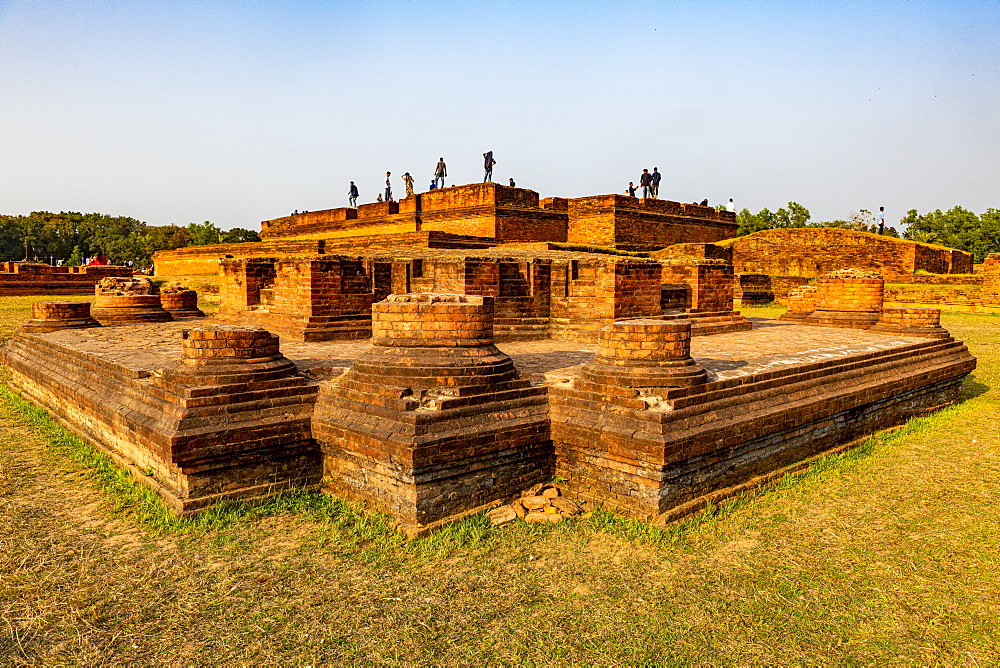 Locals posing on the Buddhist monuments of Mainamati, Bangladesh, Asia