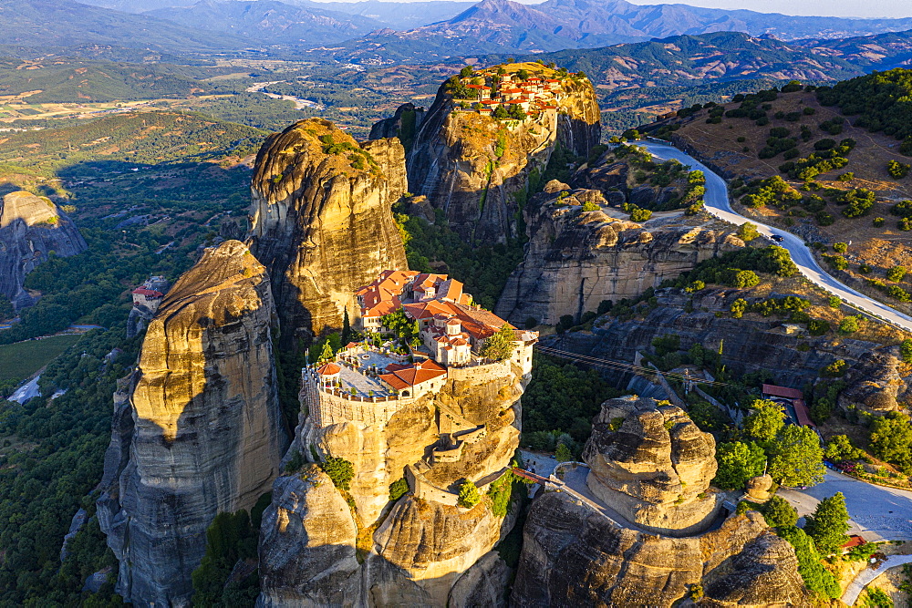 Aerial by drone of the Holy Monastery of Varlaam at sunrise, UNESCO World Heritage Site, Meteora Monasteries, Greece, Europe