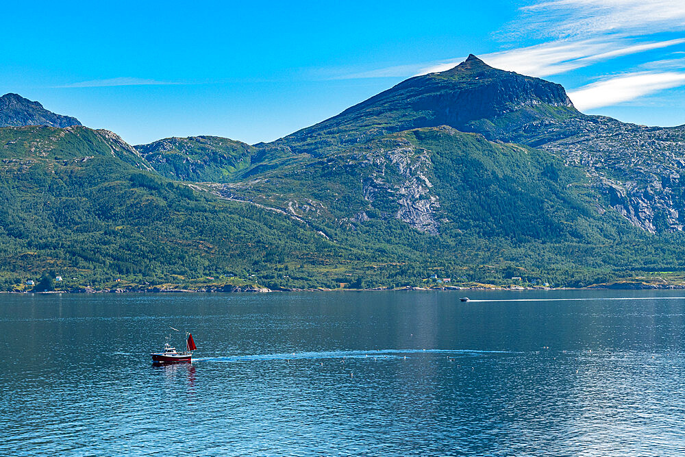 Little boat in front of rugged mountain scenery, Kystriksveien Coastal Road, Norway, Scandinavia, Europe