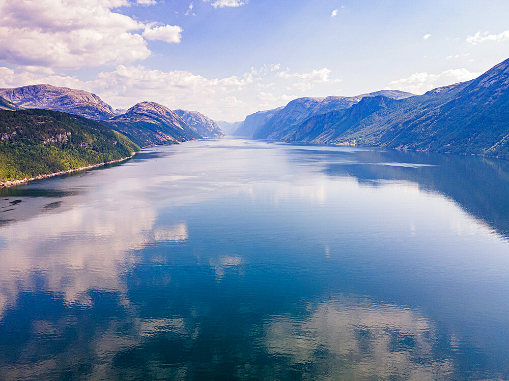 Reflections of mountains and clouds in the water, Lystrefjord (Lysefjord), Rogaland, Norway, Scandinavia, Europe