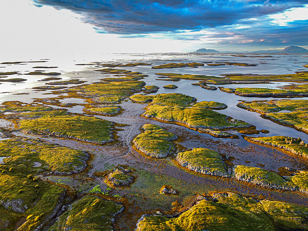 Aerial of the rugged coastline of the UNESCO World Heritage Site at sunset, the Vega Archipelago, Norway, Scandinavia, Europe