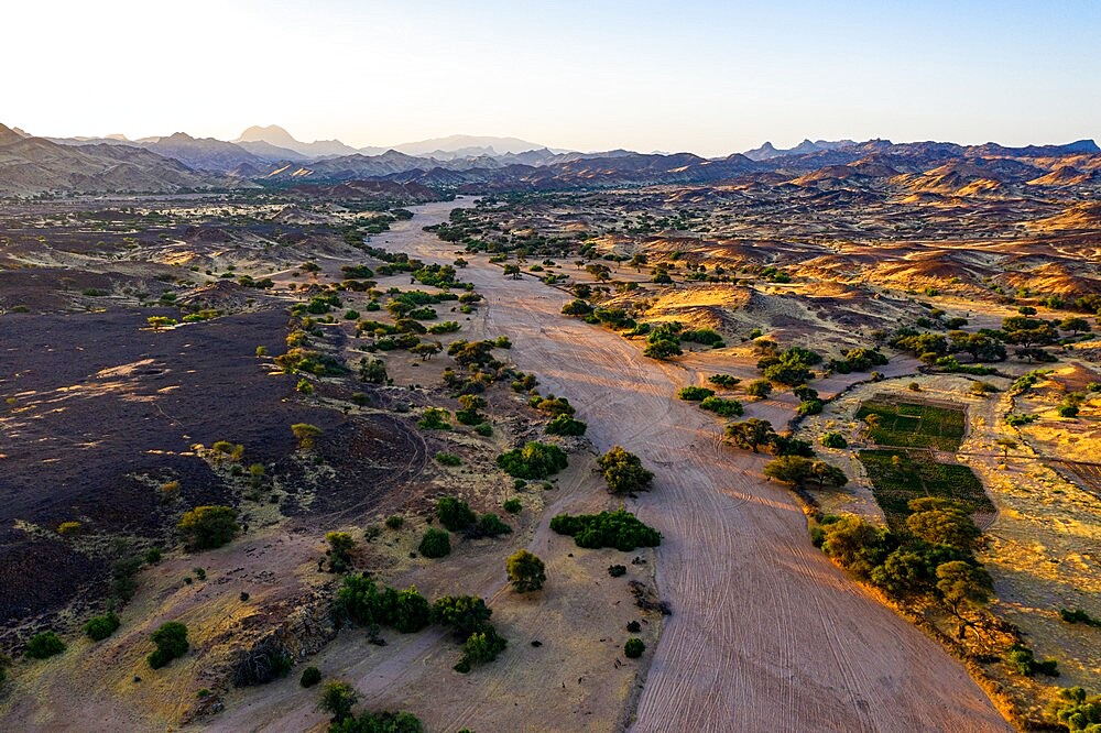 Aerial of a dry valley in the UNESCO World Heritage Site, at sunrise, Air Mountains, Niger, Africa