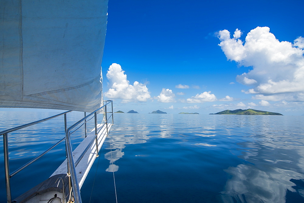 Sailing in the very flat waters of the Mamanuca Islands, Fiji, South Pacific