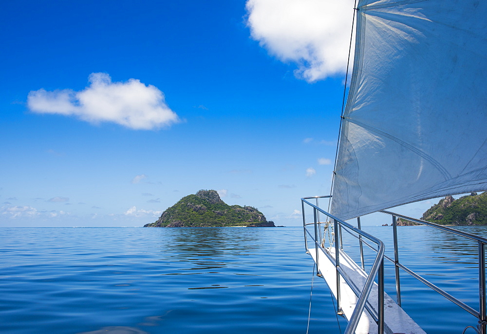 Sailing in the very flat waters of the Mamanuca Islands, Fiji, South Pacific