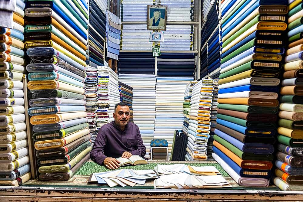 Man in his cloth shop in the Imam Ali Holy Shrine, Najaf, Iraq, Middle East