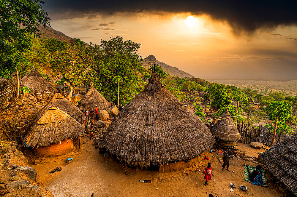 Sunset over traditional huts of the Otuho (Lotuko) tribe, Imatong mountains, Eastern Equatoria, South Sudan, Africa