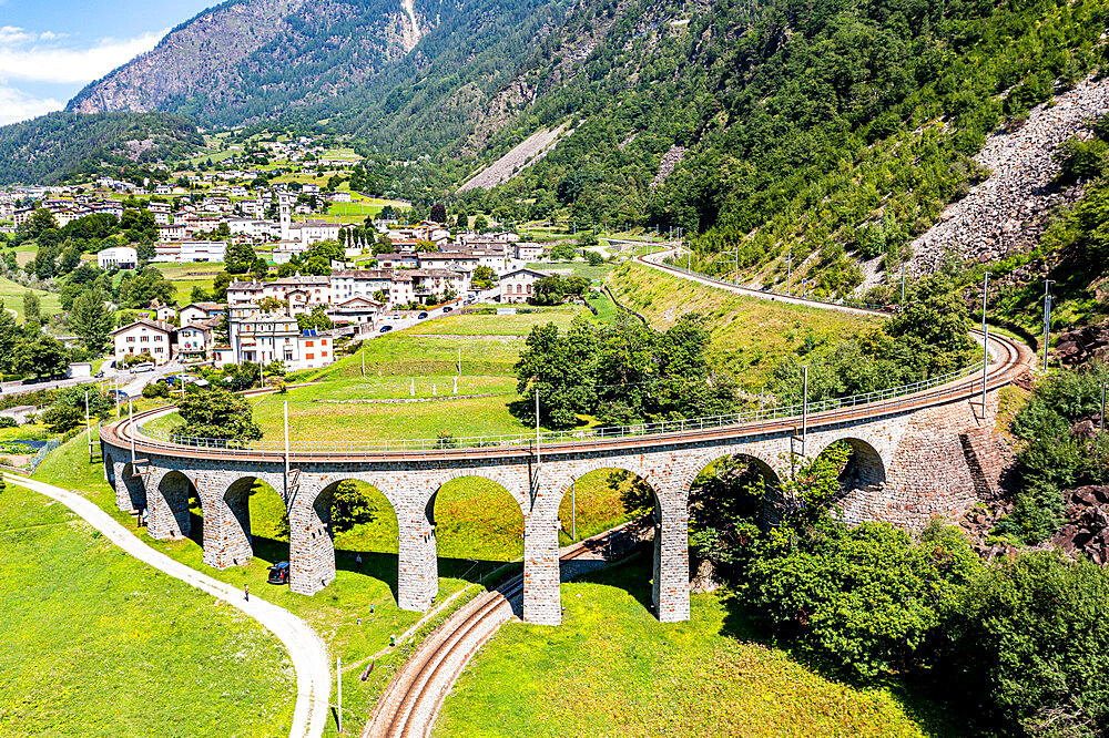 Aerial of the Brusio spiral viaduct, UNESCO World Heritage Site, Rhaetian Railway, Switzerland, Europe