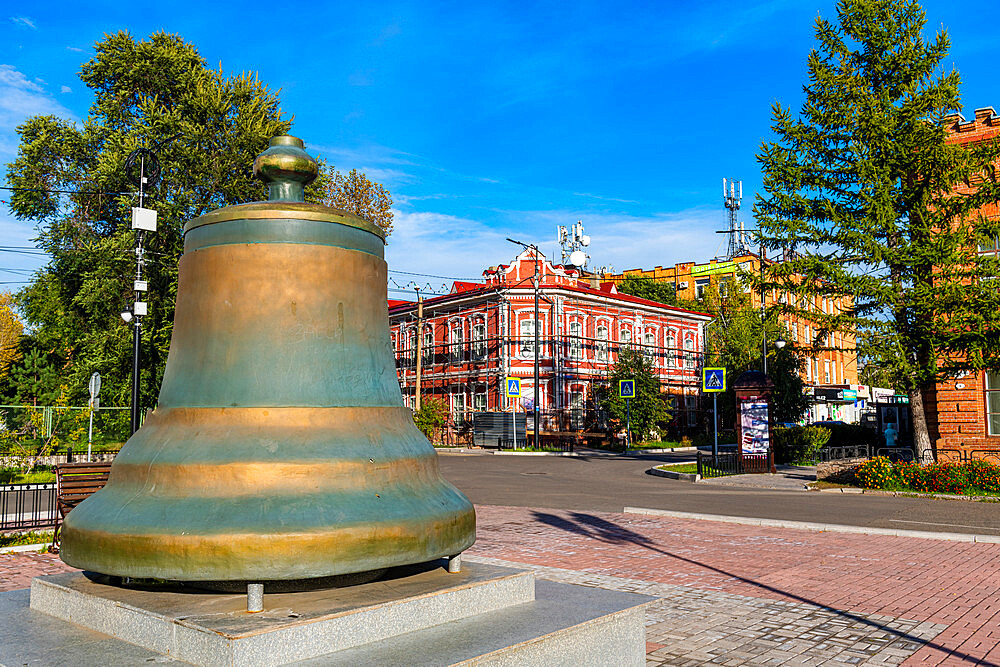 Old bell in front of Historic buildings, Minusinsk, Krasnoyarsk Krai, Russia, Eurasia